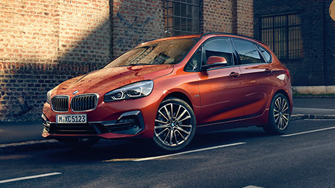 BMW 2 Series BMW 2 Series Active Tourer F45 three-quarter side view driving on the street